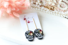 Load image into Gallery viewer, Floral Embossed Skull Floral Dangle Polymer Clay Earrings – Handmade Gothic Floral Earrings | Spooky Elegant Halloween Jewelry | KeandKi Designs
