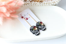 Load image into Gallery viewer, Floral Embossed Skull Floral Dangle Polymer Clay Earrings – Handmade Gothic Floral Earrings | Spooky Elegant Halloween Jewelry | KeandKi Designs