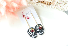 Load image into Gallery viewer, Embossed Skull Floral Dangle Polymer Clay Earrings – Handmade Gothic Floral Earrings | Spooky Elegant Halloween Jewelry | KeandKi Designs