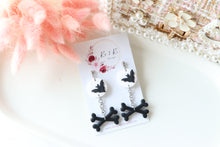 Load image into Gallery viewer, Bat and Bone Polymer Clay Earrings – Handmade Halloween Earrings | Spooky Gothic Statement Jewelry | KeandKi Designs