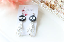 Load image into Gallery viewer, Tiny Skull Head & Steel Skeletal Hand Dangle Earrings – Handmade Gothic Halloween Jewelry | Polymer Clay Skull Earrings | KeandKi Designs