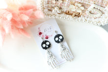 Load image into Gallery viewer, Tiny Skull Head & Steel Skeletal Hand Dangle Earrings – Handmade Gothic Halloween Jewelry | Polymer Clay Skull Earrings | KeandKi Designs