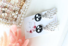 Load image into Gallery viewer, Tiny Skull Head &amp; Steel Skeletal Hand Dangle Earrings – Handmade Gothic Halloween Jewelry | Polymer Clay Skull Earrings | KeandKi Designs
